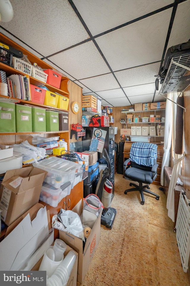 interior space featuring a drop ceiling