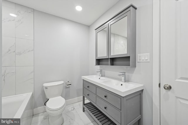 bathroom with marble finish floor, double vanity, toilet, a sink, and baseboards