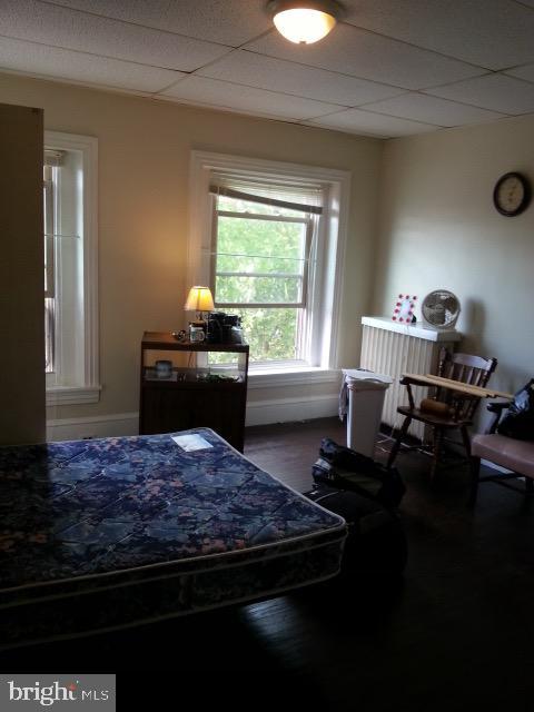 bedroom with a paneled ceiling