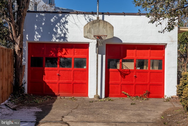 garage with fence