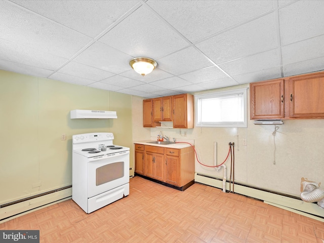 kitchen featuring a drop ceiling, a baseboard radiator, under cabinet range hood, light countertops, and white range with electric cooktop