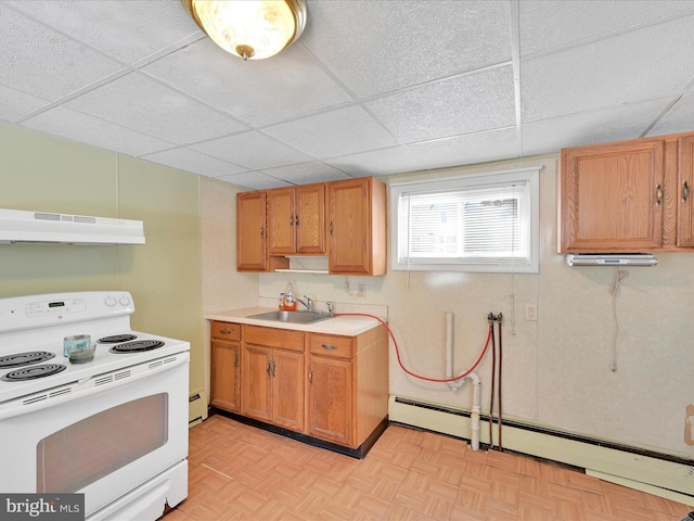 kitchen with electric stove, light countertops, under cabinet range hood, a baseboard heating unit, and a sink