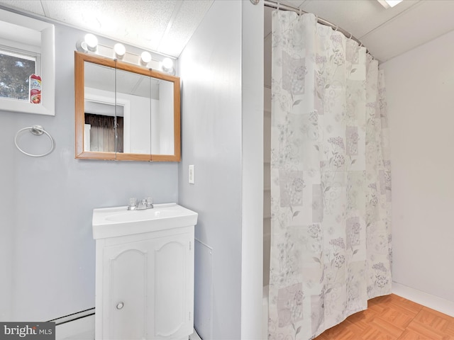 bathroom featuring a shower with curtain and vanity