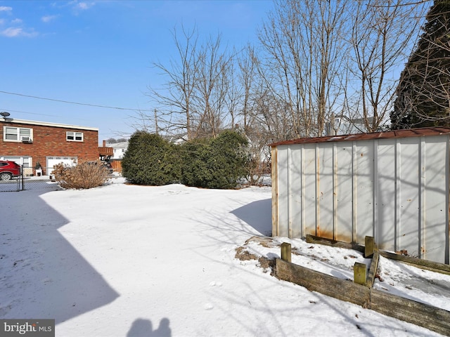 yard layered in snow with fence