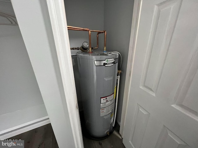 utility room featuring water heater