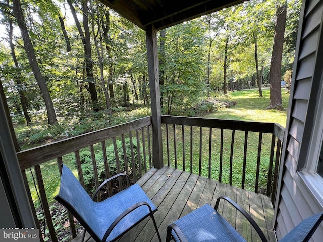 wooden deck with a yard