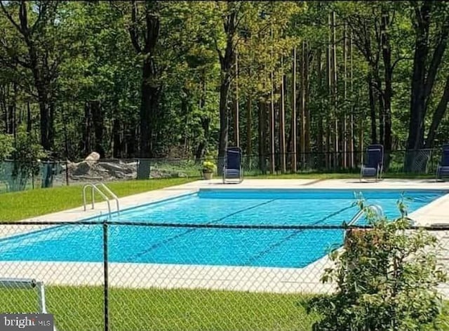 community pool with fence