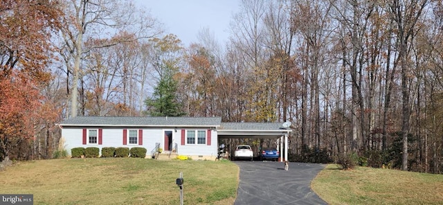 view of front of house with crawl space, driveway, a front lawn, and a carport