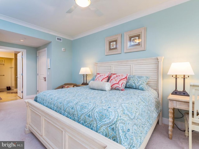 bedroom featuring baseboards, light colored carpet, visible vents, and crown molding