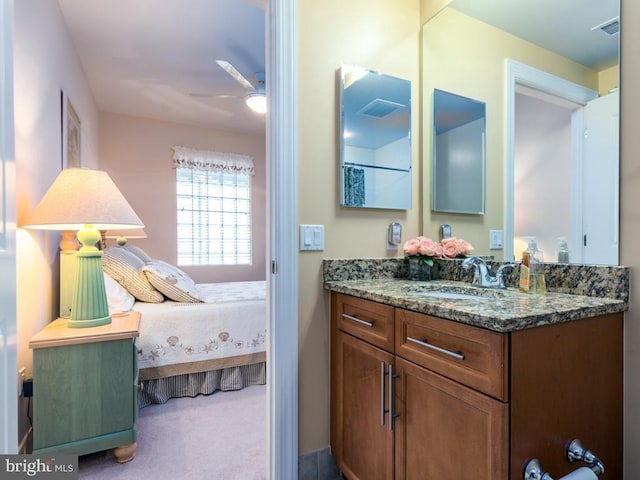 bathroom with a ceiling fan, visible vents, vanity, and ensuite bath