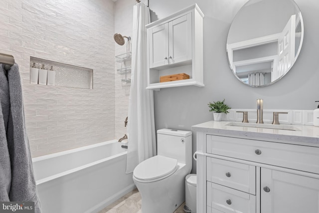 full bath featuring shower / bath combo, vanity, and toilet