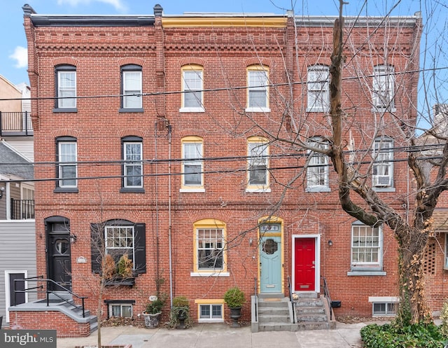 multi unit property with entry steps and brick siding