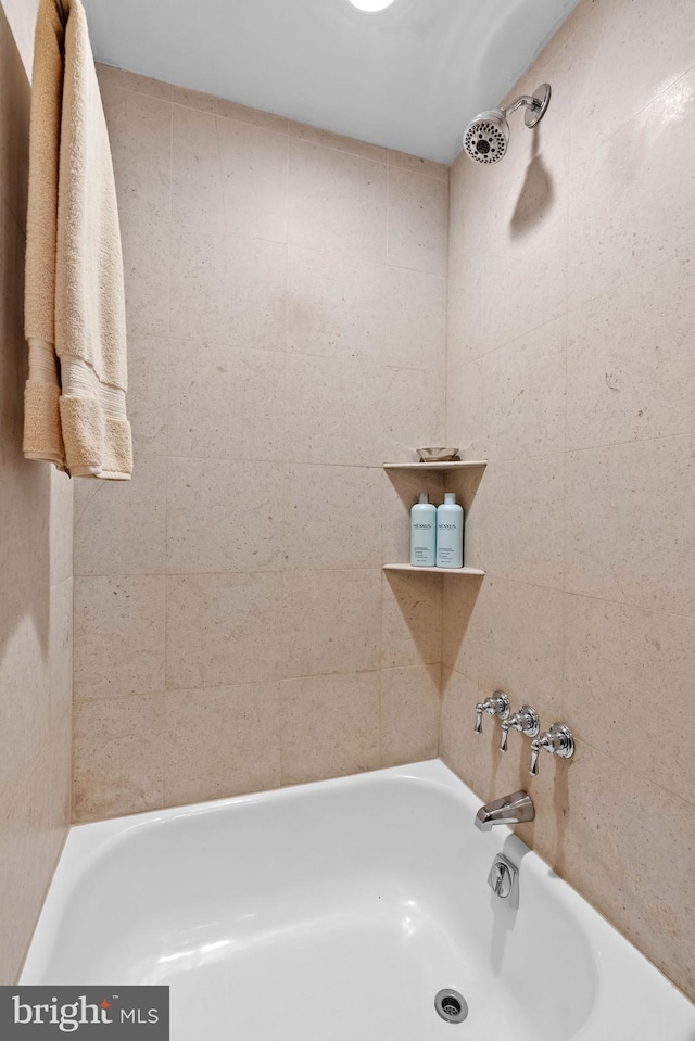 bathroom featuring a tub to relax in