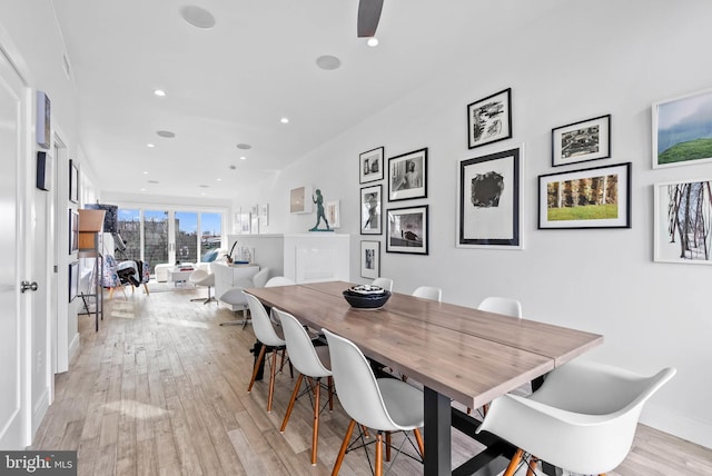 dining space with recessed lighting, baseboards, and light wood finished floors