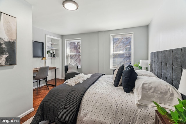 bedroom featuring baseboards