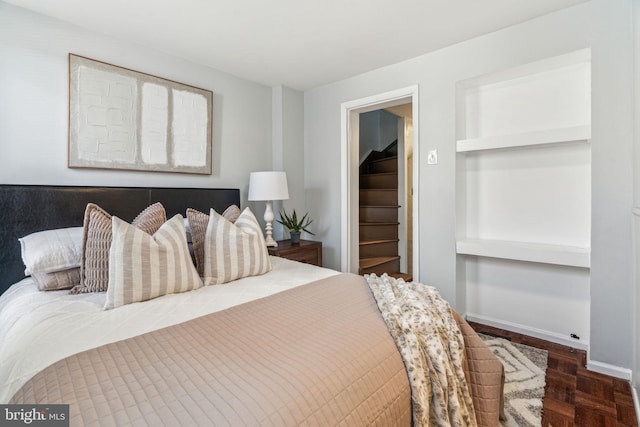 bedroom featuring baseboards