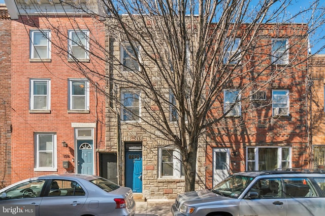 view of property with stone siding