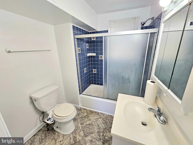 full bath with baseboards, combined bath / shower with glass door, vanity, and toilet