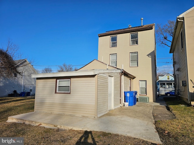 rear view of property featuring a patio area