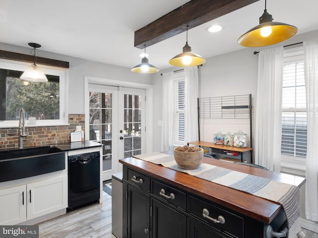 kitchen featuring black dishwasher, french doors, a sink, butcher block countertops, and dark cabinetry