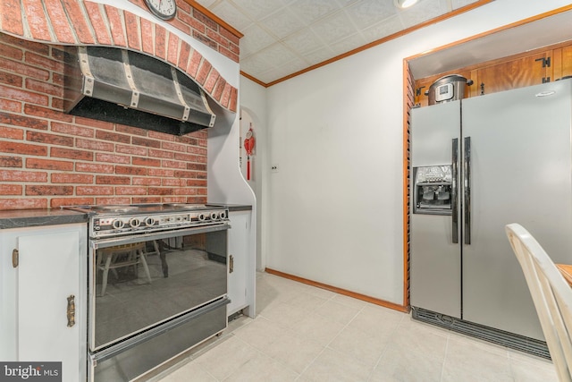 kitchen featuring range with electric cooktop, stainless steel fridge with ice dispenser, dark countertops, crown molding, and under cabinet range hood