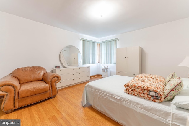 bedroom with light wood finished floors