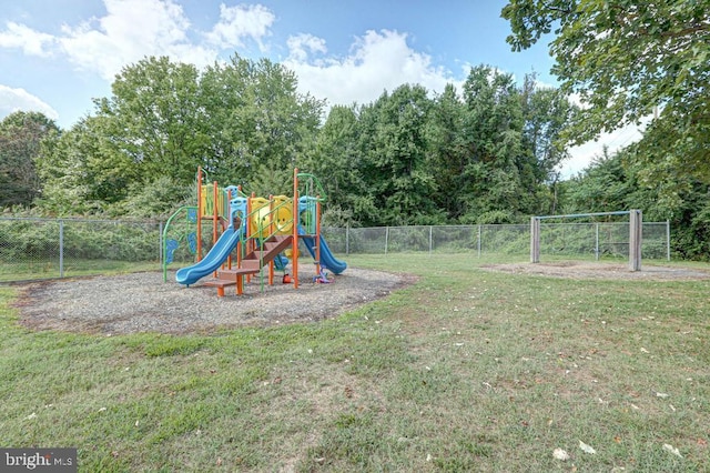 community playground featuring fence and a lawn