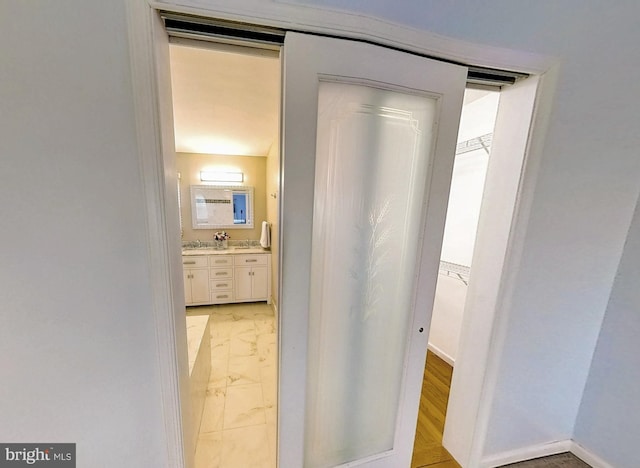 interior space with marble finish floor and baseboards