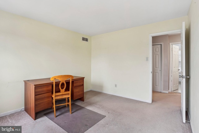 office space featuring carpet, visible vents, and baseboards