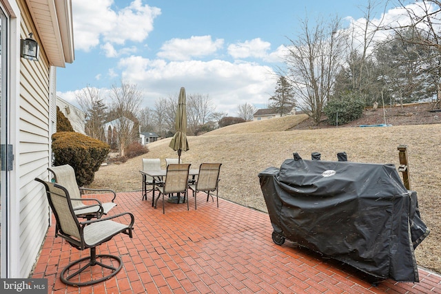 view of patio featuring outdoor dining space and area for grilling