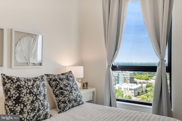 bedroom featuring a view of city