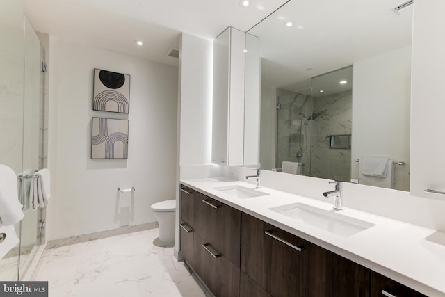 bathroom with recessed lighting, marble finish floor, a sink, and a marble finish shower