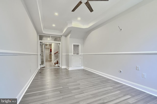 unfurnished living room featuring light wood-style floors, recessed lighting, baseboards, and stairs