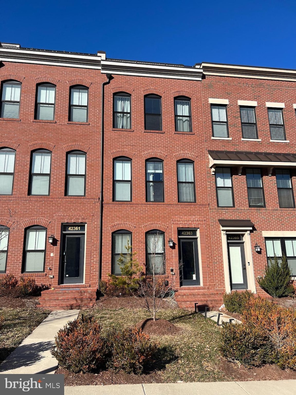 view of property with brick siding