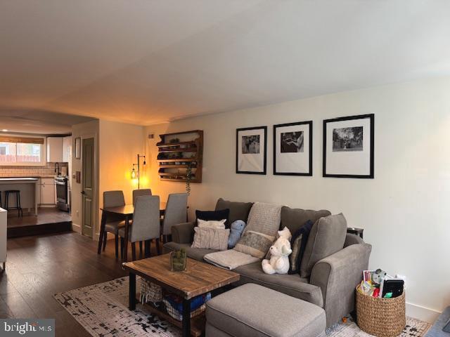 living room featuring dark wood-style floors