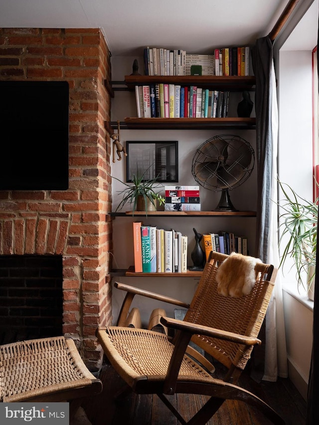 sitting room with a fireplace