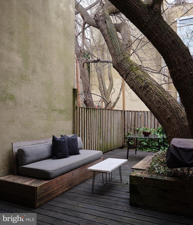 wooden deck featuring outdoor lounge area