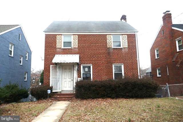 view of front of house featuring brick siding