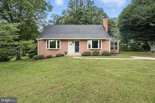 6910 Barnack Dr, Springfield, VA 22152 - view of front of property with brick siding, a front lawn, a chimney, and a shingled roof