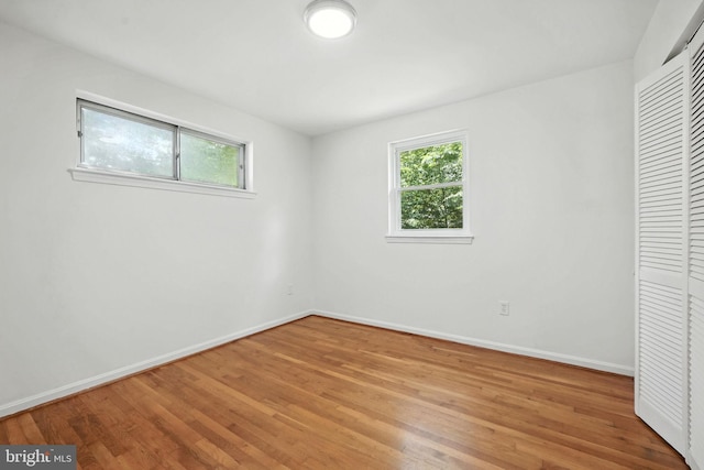 6910 Barnack Dr, Springfield, VA 22152 - unfurnished bedroom featuring light wood-style floors and a closet