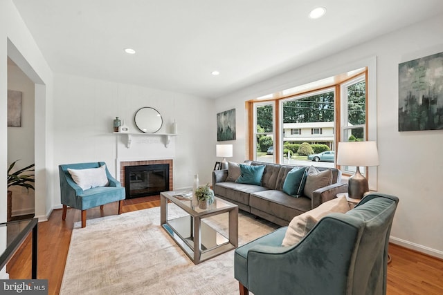 6910 Barnack Dr, Springfield, VA 22152 - living room featuring wood finished floors, a fireplace, and recessed lighting