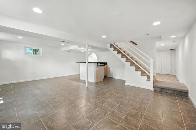 6910 Barnack Dr, Springfield, VA 22152 - below grade area with recessed lighting, stairway, and dark tile patterned floors