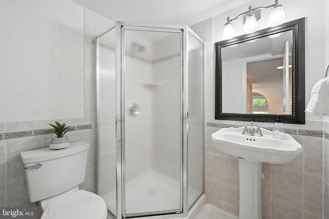 6910 Barnack Dr, Springfield, VA 22152 - bathroom with tile walls and a shower stall