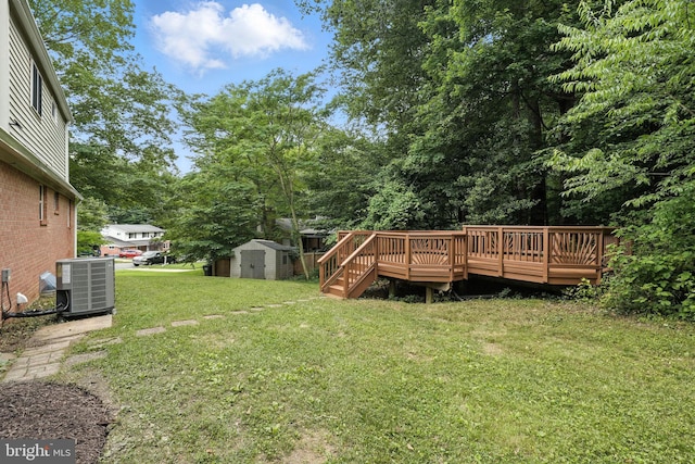 6910 Barnack Dr, Springfield, VA 22152 - view of grassy yard featuring a shed and a deck