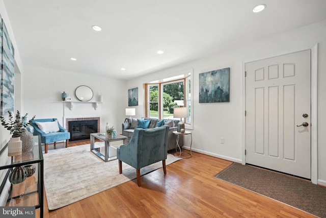 6910 Barnack Dr, Springfield, VA 22152 - living room with a fireplace, wood finished floors, and recessed lighting