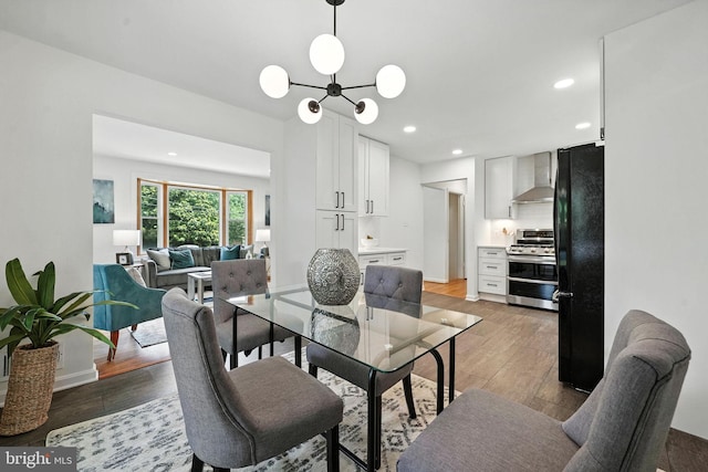 6910 Barnack Dr, Springfield, VA 22152 - dining room featuring light wood finished floors, recessed lighting, and a chandelier