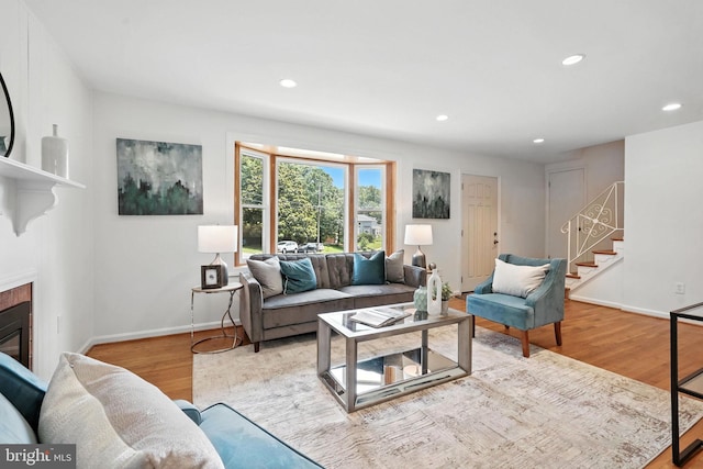 6910 Barnack Dr, Springfield, VA 22152 - living room featuring recessed lighting, stairway, wood finished floors, and a fireplace