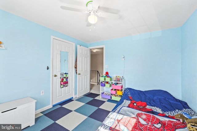 bedroom featuring ceiling fan, baseboards, and tile patterned floors