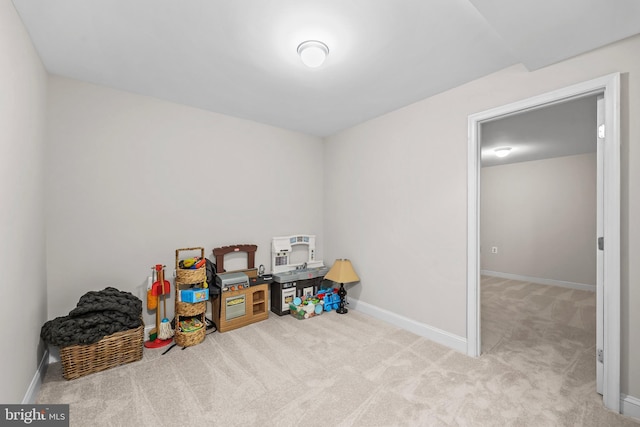 game room with carpet floors and baseboards