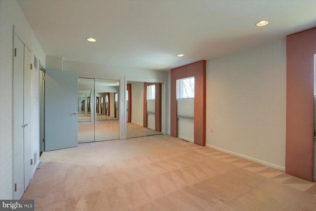 unfurnished room featuring recessed lighting, carpet flooring, and baseboards